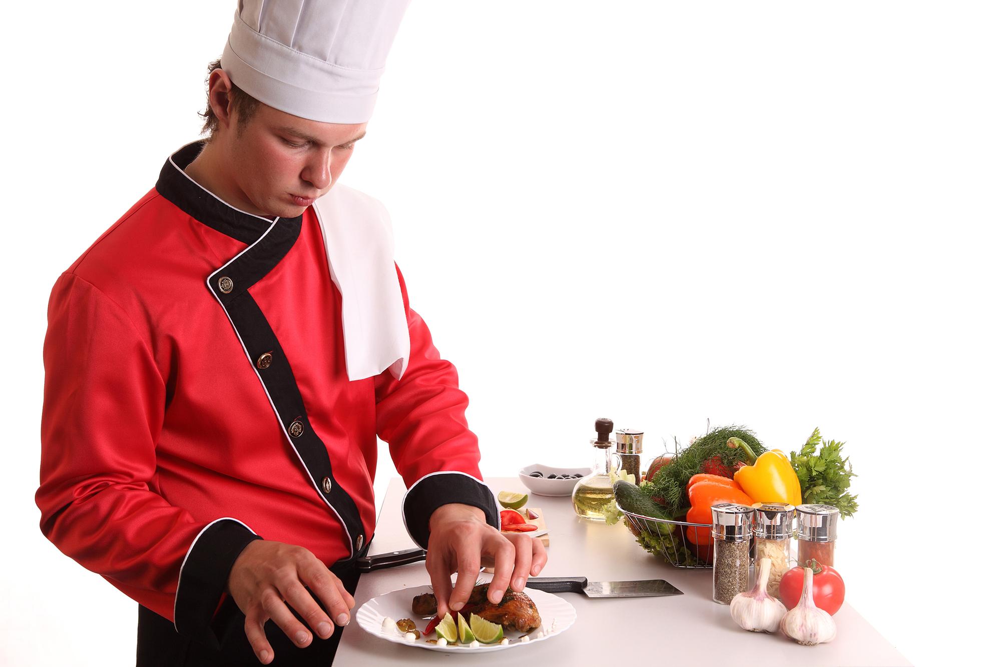 Chef demonstrating plating in a home kitchen